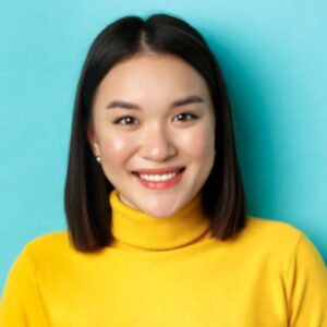 Team Member Female wearing yellow Shirt close up